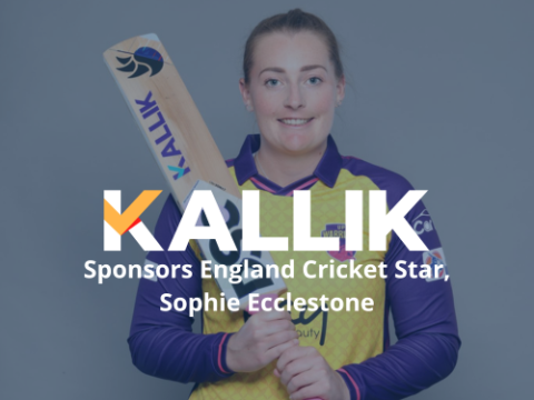 Sophie holding Kallik branded cricket bat